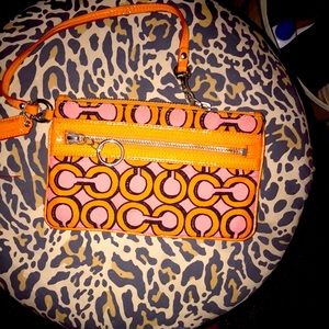 Orange and hot pink coach wristlet/ clutch